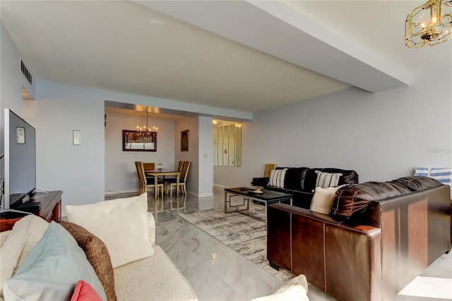 living room with a notable chandelier