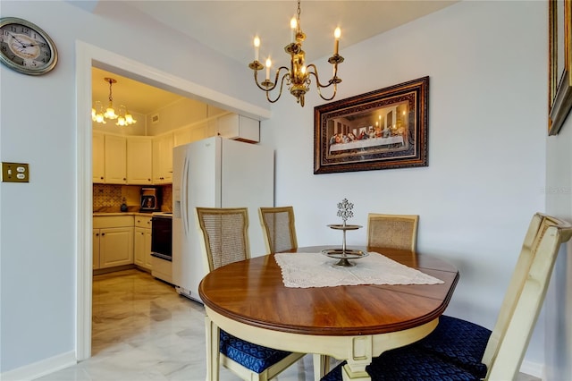 dining space featuring a notable chandelier