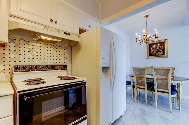 kitchen with a notable chandelier, white cabinetry, white appliances, and tasteful backsplash