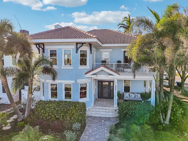 mediterranean / spanish-style house with a balcony