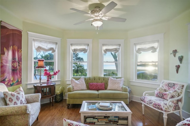 sunroom featuring ceiling fan