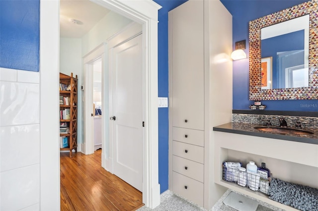 bathroom featuring hardwood / wood-style flooring and vanity