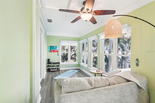 sunroom featuring ceiling fan