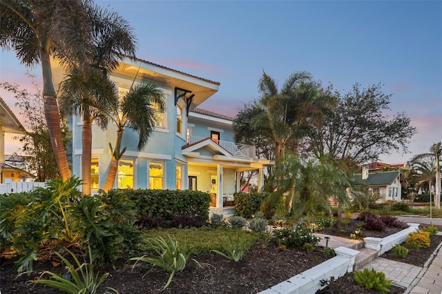 mediterranean / spanish house featuring a balcony