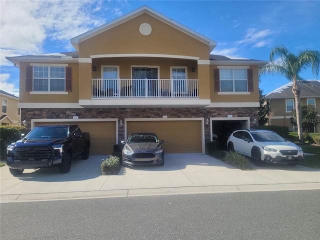 view of front of home featuring a garage and a balcony