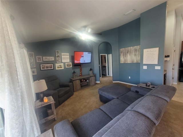 living room featuring carpet floors and vaulted ceiling