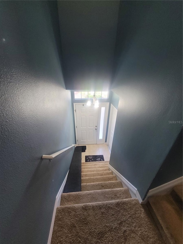 stairs with tile patterned flooring