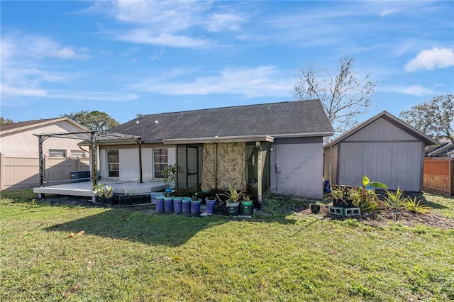 back of house with a lawn