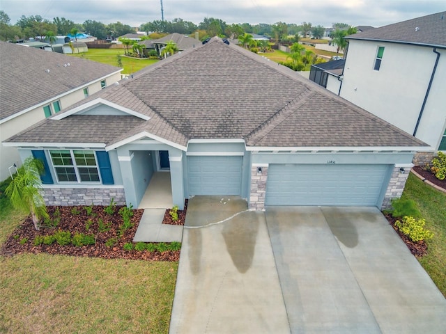 view of front facade with a garage and a front yard