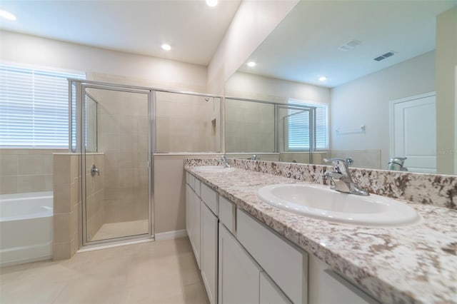 bathroom featuring tile patterned floors, vanity, and separate shower and tub