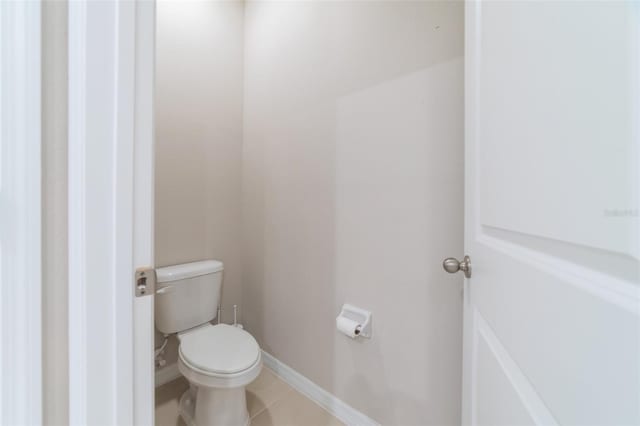 bathroom with tile patterned floors and toilet