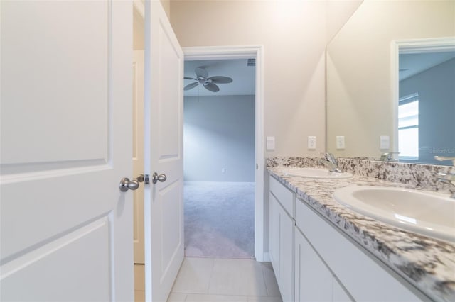 bathroom featuring tile patterned flooring, vanity, and ceiling fan