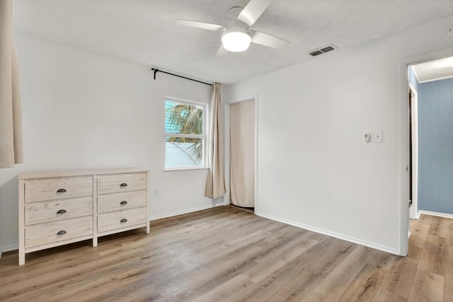 unfurnished bedroom featuring ceiling fan and light wood-type flooring