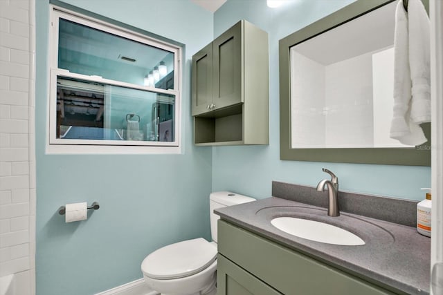 bathroom with toilet, a shower, and vanity