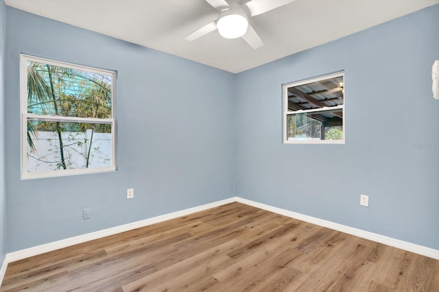 spare room with ceiling fan and light hardwood / wood-style flooring