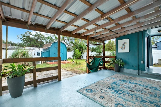 view of patio / terrace featuring a shed