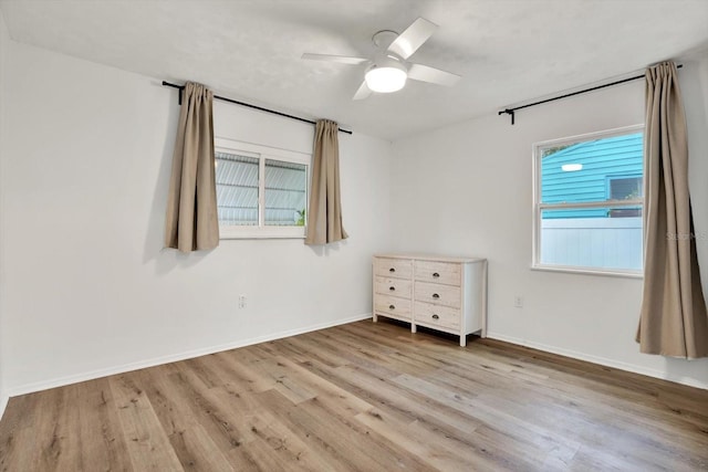 unfurnished bedroom featuring ceiling fan and light hardwood / wood-style flooring