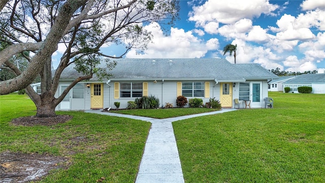 ranch-style house featuring a front lawn