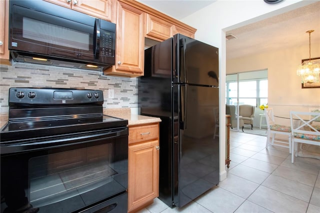 kitchen featuring black appliances, hanging light fixtures, light tile patterned floors, tasteful backsplash, and a notable chandelier