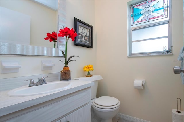 bathroom featuring vanity and toilet