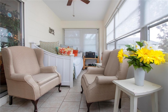 sunroom / solarium featuring ceiling fan