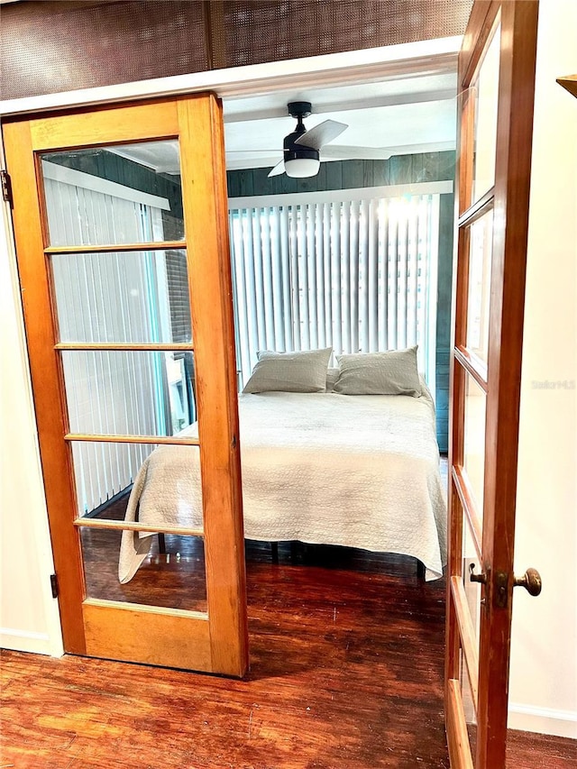 bedroom featuring wood-type flooring and ceiling fan