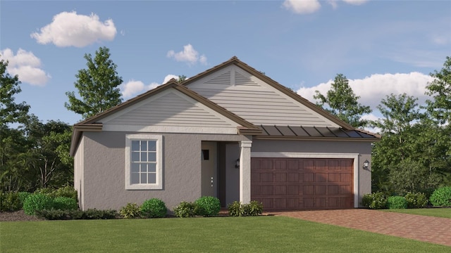 view of front of property featuring a front yard and a garage