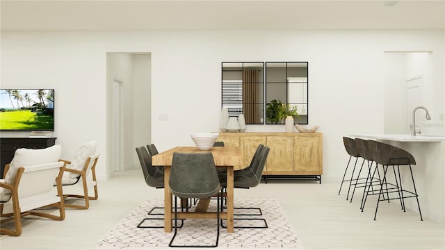 dining space featuring sink