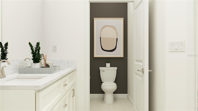 bathroom featuring tile patterned flooring, vanity, and toilet