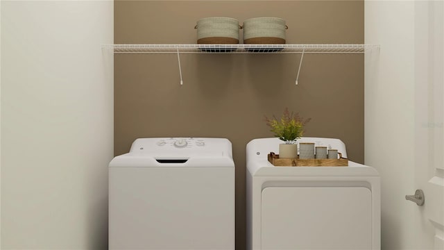 laundry room with separate washer and dryer