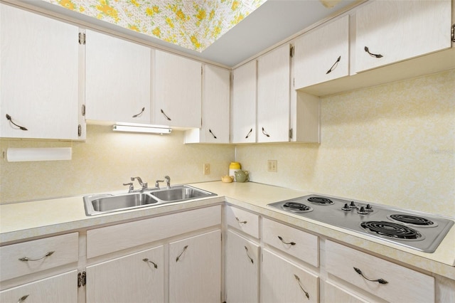 kitchen featuring white electric stovetop and sink