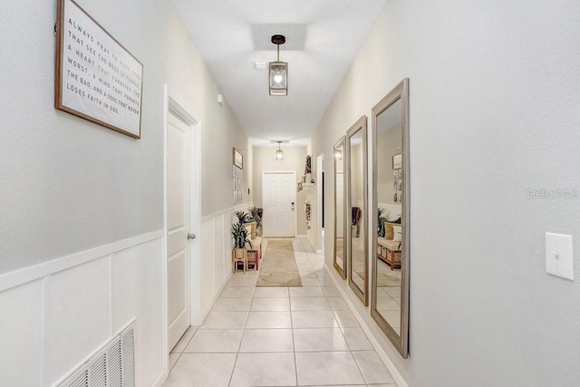 hallway with light tile patterned flooring