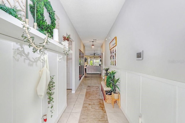 hallway featuring light tile patterned floors