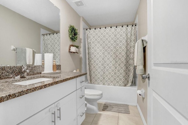 full bathroom featuring tile patterned flooring, vanity, shower / bath combo, and toilet