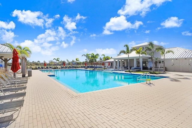 view of swimming pool with a patio