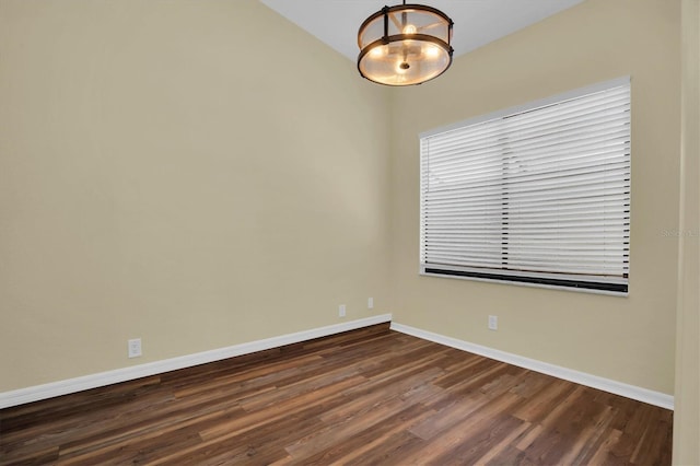 empty room with dark wood-type flooring