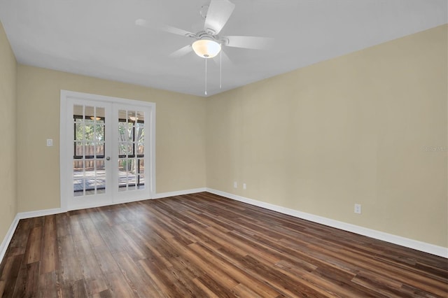 spare room featuring french doors, dark hardwood / wood-style flooring, and ceiling fan