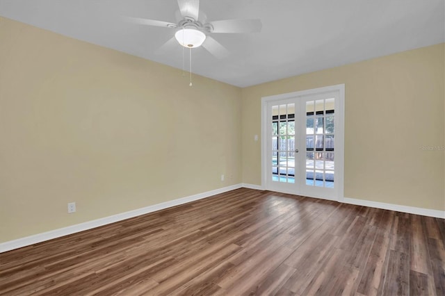 spare room with hardwood / wood-style flooring, ceiling fan, and french doors