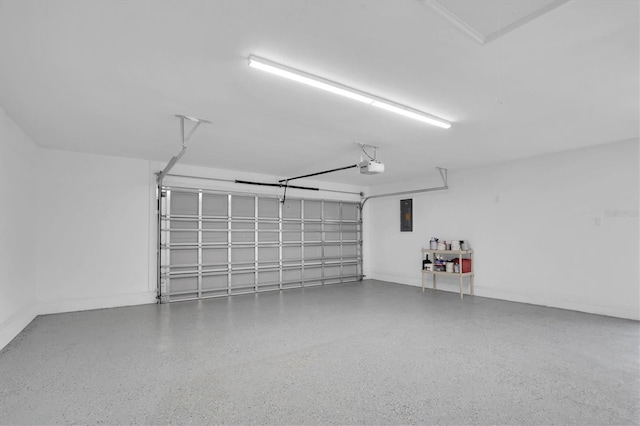 garage featuring electric panel and a garage door opener