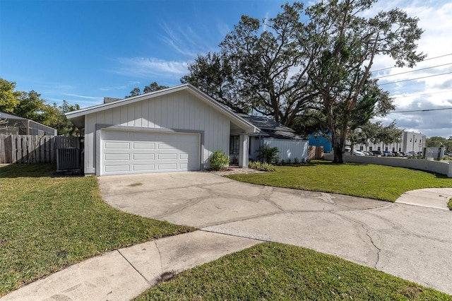 ranch-style house with a front lawn and a garage