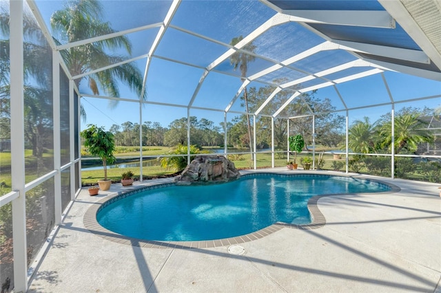 view of pool featuring a lanai and a patio