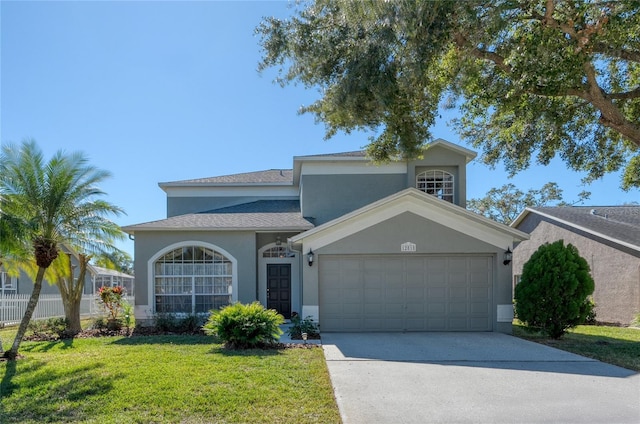 view of front property with a front yard and a garage