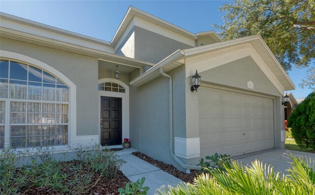 entrance to property featuring a garage