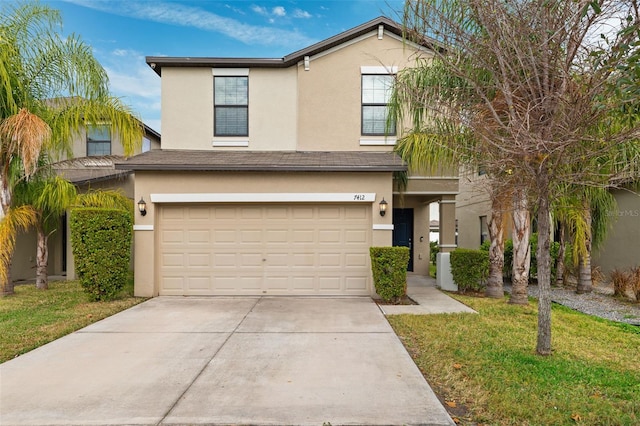 view of front facade with a garage and a front lawn