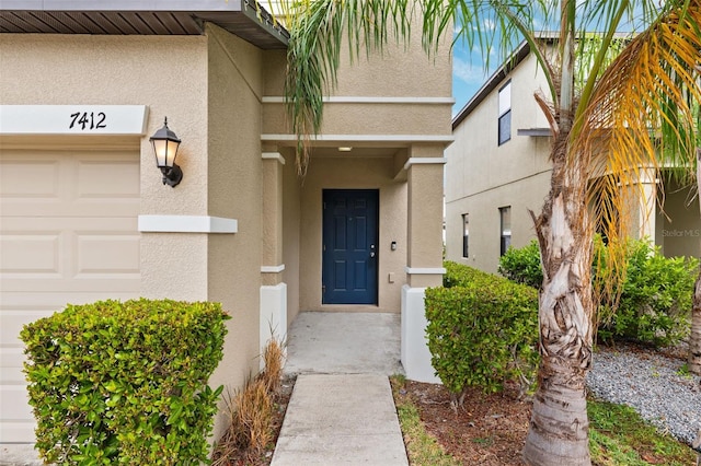 doorway to property featuring a garage