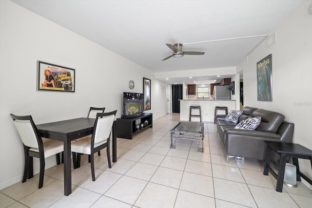 tiled living room with ceiling fan