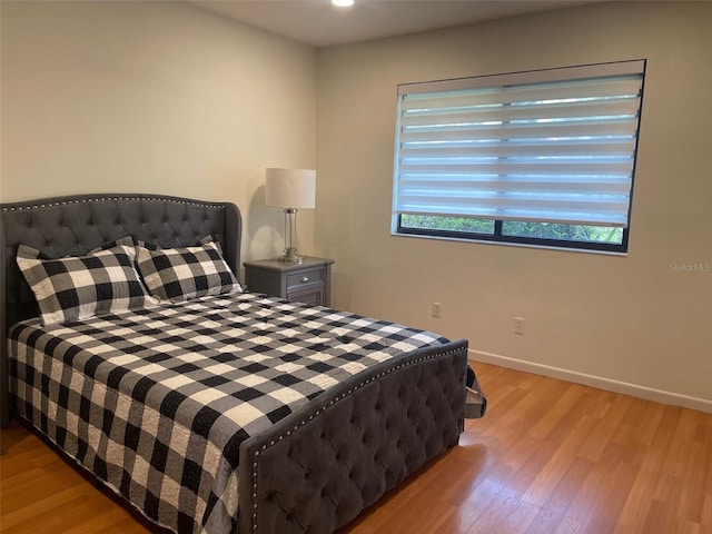 bedroom with light hardwood / wood-style flooring