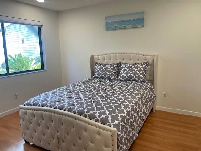 bedroom featuring hardwood / wood-style flooring