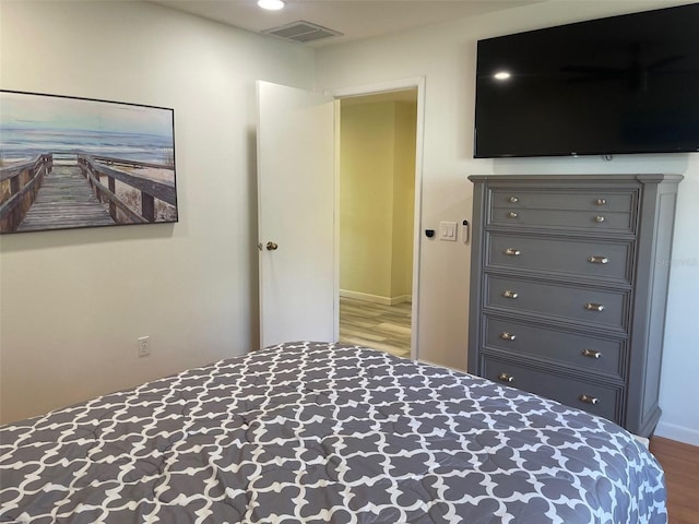 unfurnished bedroom with wood-type flooring