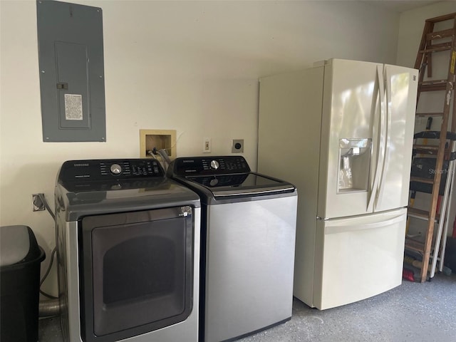 laundry room featuring separate washer and dryer and electric panel